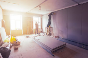 workers restoring home interior