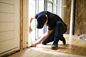 man repairing home interior